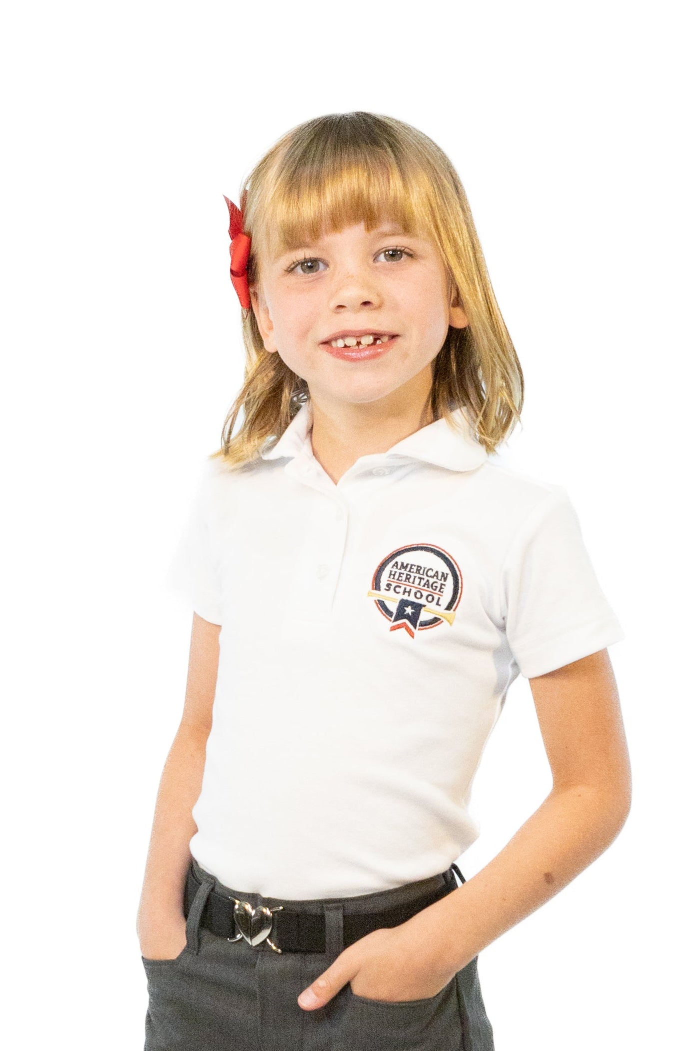 Young girl wearing a white polo shirt with a logo and gray shorts on a white background