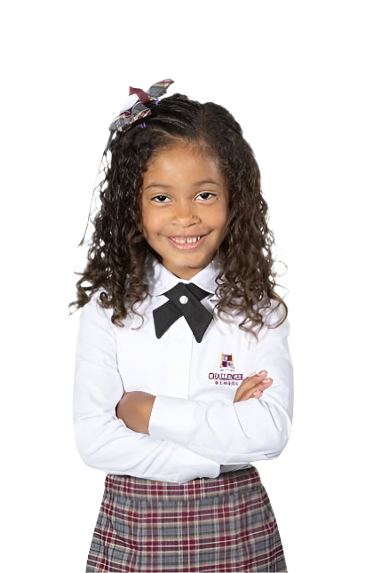 A girl wearing a white long sleeve Oxford blouse with a rounded collar, paired with a skirt and white tights.