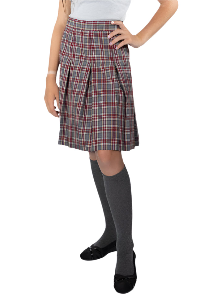 Plaid skirt worn by a person on a white background