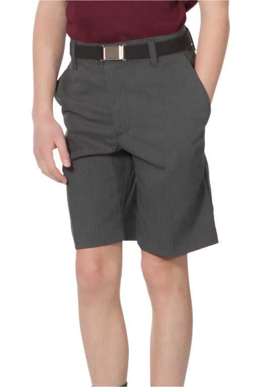 A boy standing against a white background wearing charcoal gray shorts and a maroon polo shirt.